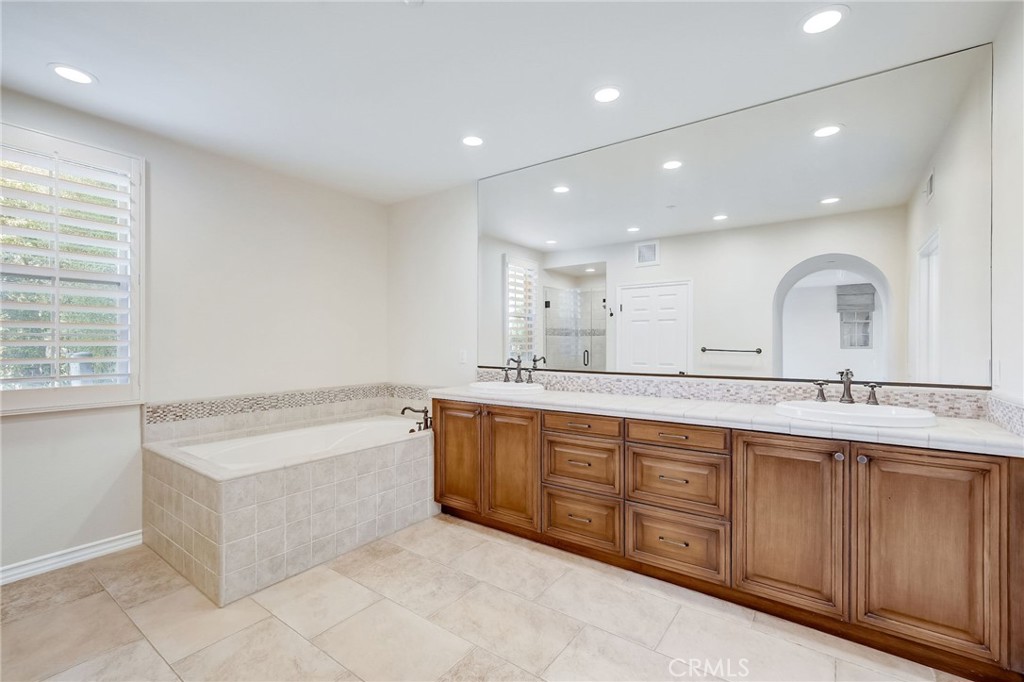 7 Tuscany Ladera Ranch, CA 92694 - Photo 22 of 39 a large bathroom with a large tub and sink