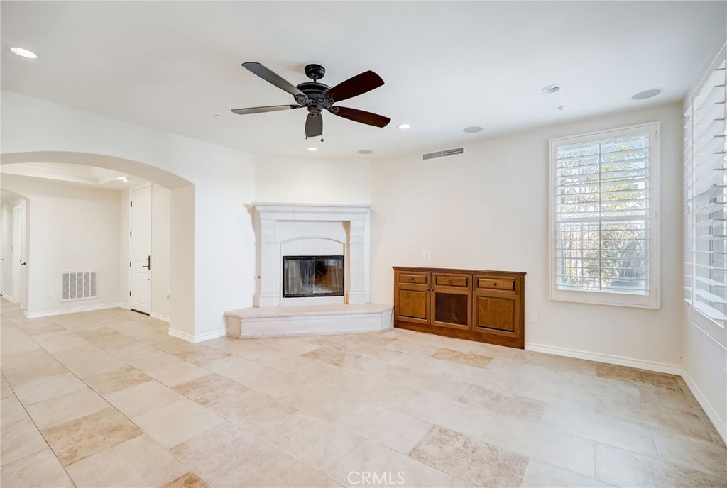 7 Tuscany Ladera Ranch, CA 92694 - Photo 5 of 39 a view of an empty room with a fireplace and a window
