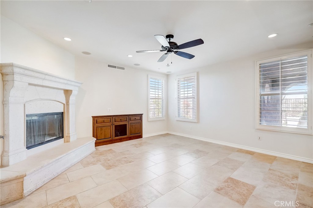 7 Tuscany Ladera Ranch, CA 92694 - Photo 6 of 39 a view of an empty room with a fireplace and a window