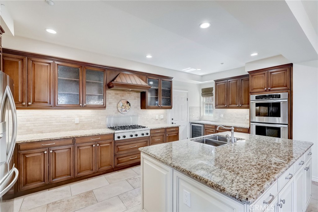 7 Tuscany Ladera Ranch, CA 92694 - Photo 10 of 39 a kitchen with stainless steel appliances granite countertop a sink and cabinets