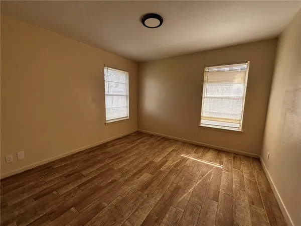 a view of an empty room and a window