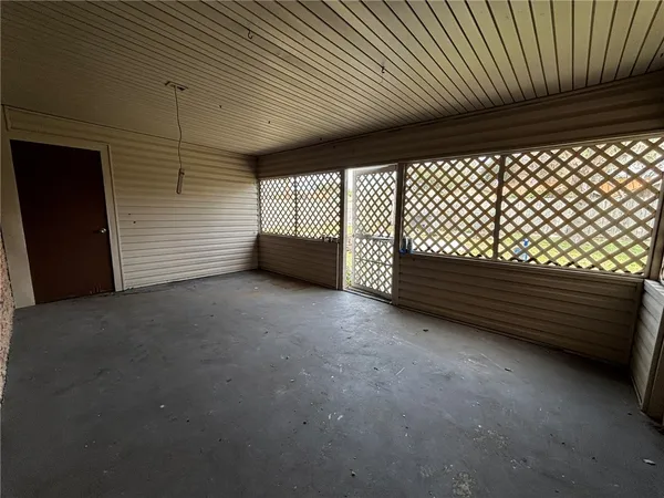 a view of outdoor space with wooden floor