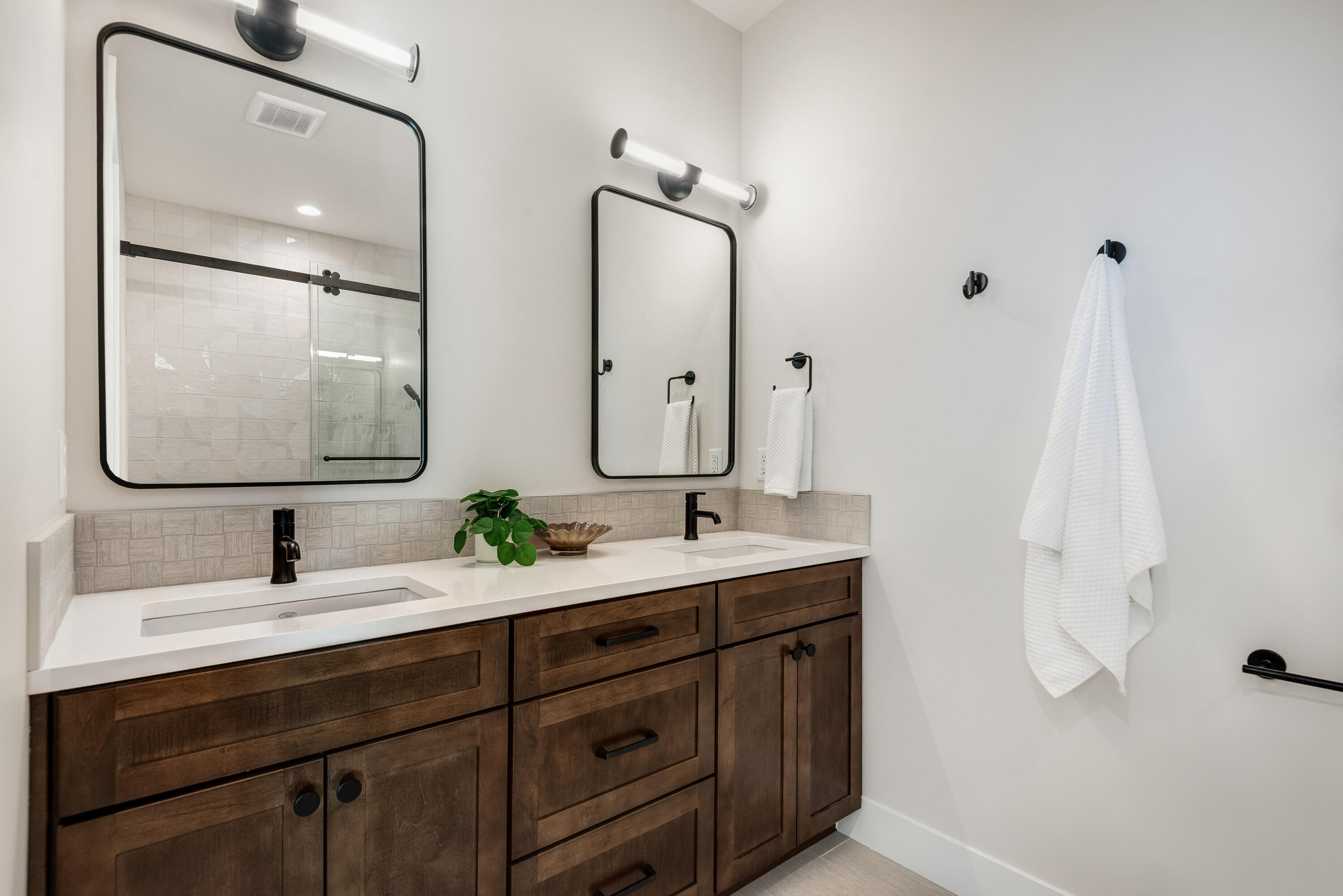 334 Southwest Roosevelt Avenue, Unit 4 Bend, OR 97702 - Photo 14 of 22 a bathroom with a double vanity sink mirror and