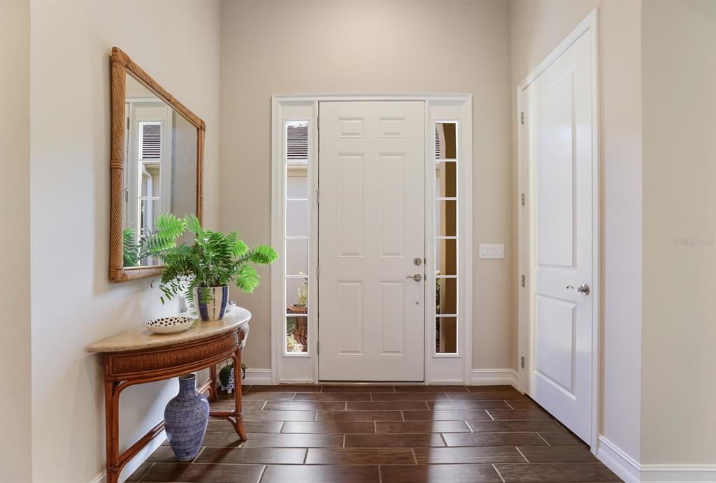 2402 Starwood Court Lakewood Ranch, FL 34211 - Photo 11 of 71 a view of an entryway with wooden floor