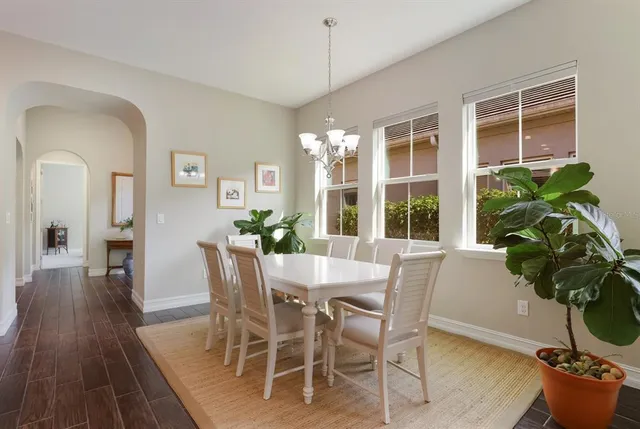 a kitchen with kitchen island stainless steel appliances a stove a sink and a refrigerator