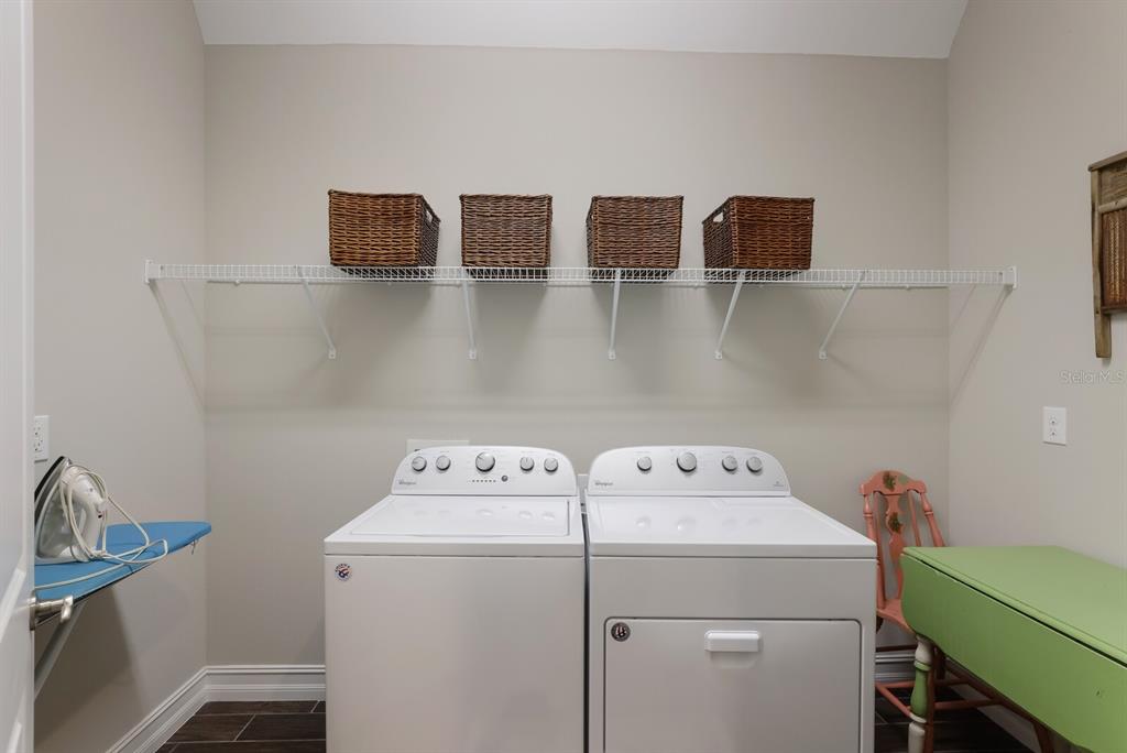 2402 Starwood Court Lakewood Ranch, FL 34211 - Photo 19 of 71 a utility room with dryer and washer