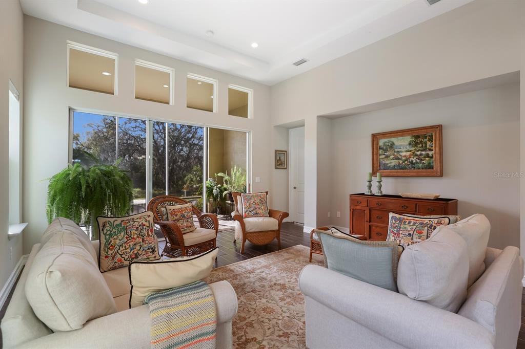 2402 Starwood Court Lakewood Ranch, FL 34211 - Photo 21 of 71 a living room with furniture and a large window