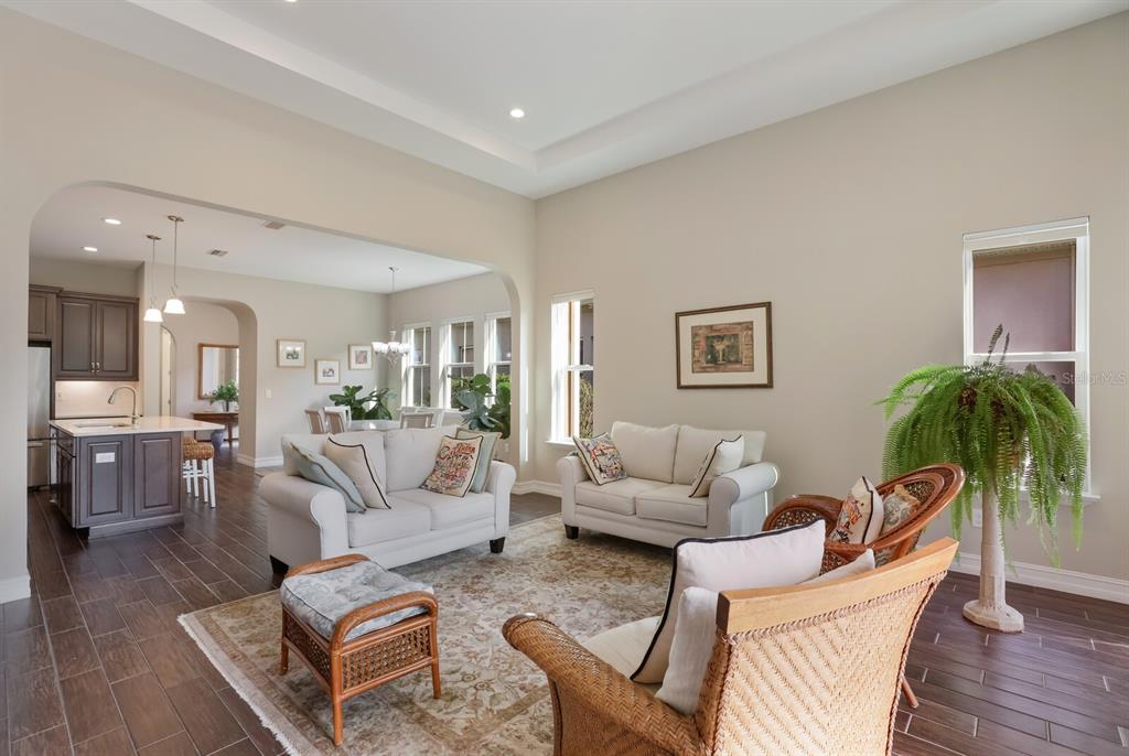 2402 Starwood Court Lakewood Ranch, FL 34211 - Photo 24 of 71 a living room with furniture potted plant and a table