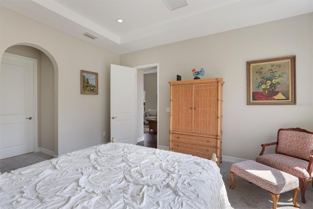 2402 Starwood Court Lakewood Ranch, FL 34211 - Photo 26 of 71 a bedroom with a bed and a couch