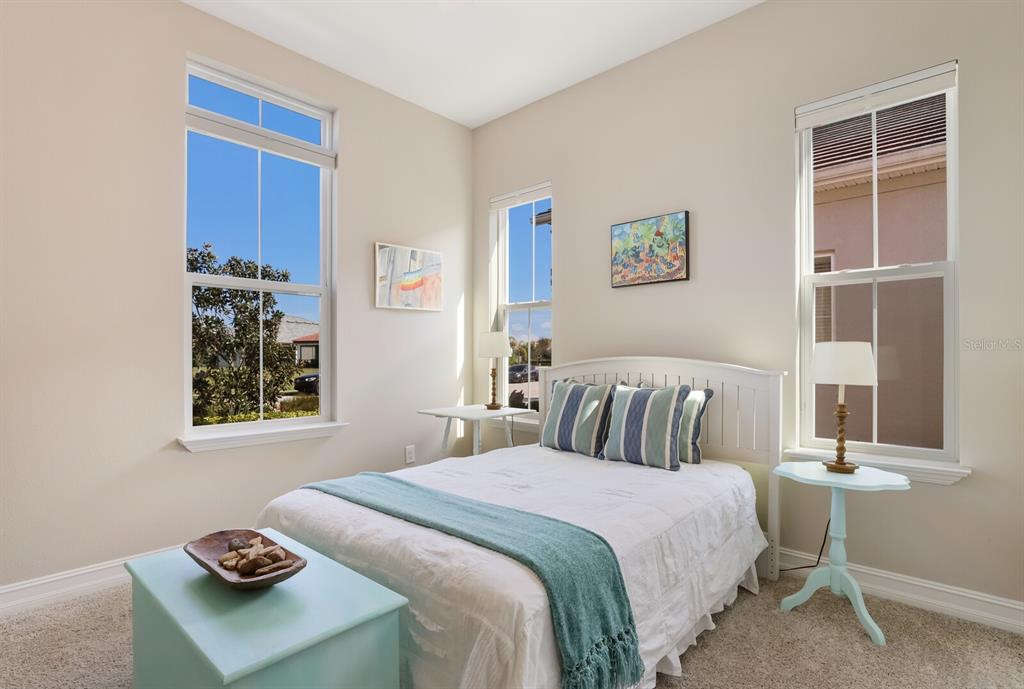 2402 Starwood Court Lakewood Ranch, FL 34211 - Photo 30 of 71 a bedroom with a bed and a window