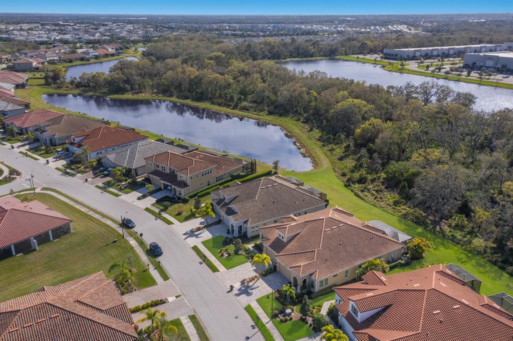 2402 Starwood Court Lakewood Ranch, FL 34211 - Photo 40 of 71 an aerial view of residential houses with outdoor space