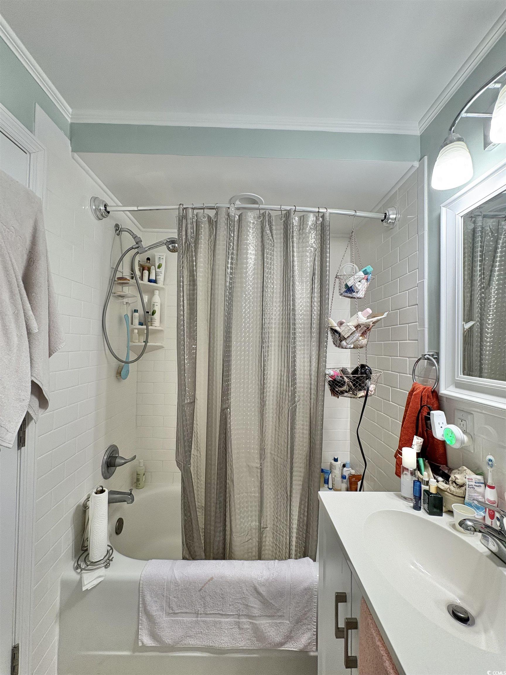 520-526 Boundary Avenue Murrells Inlet, SC 29576 - Photo 16 of 38 Full bath with shower / bath combo with shower curtain, vanity, and crown molding