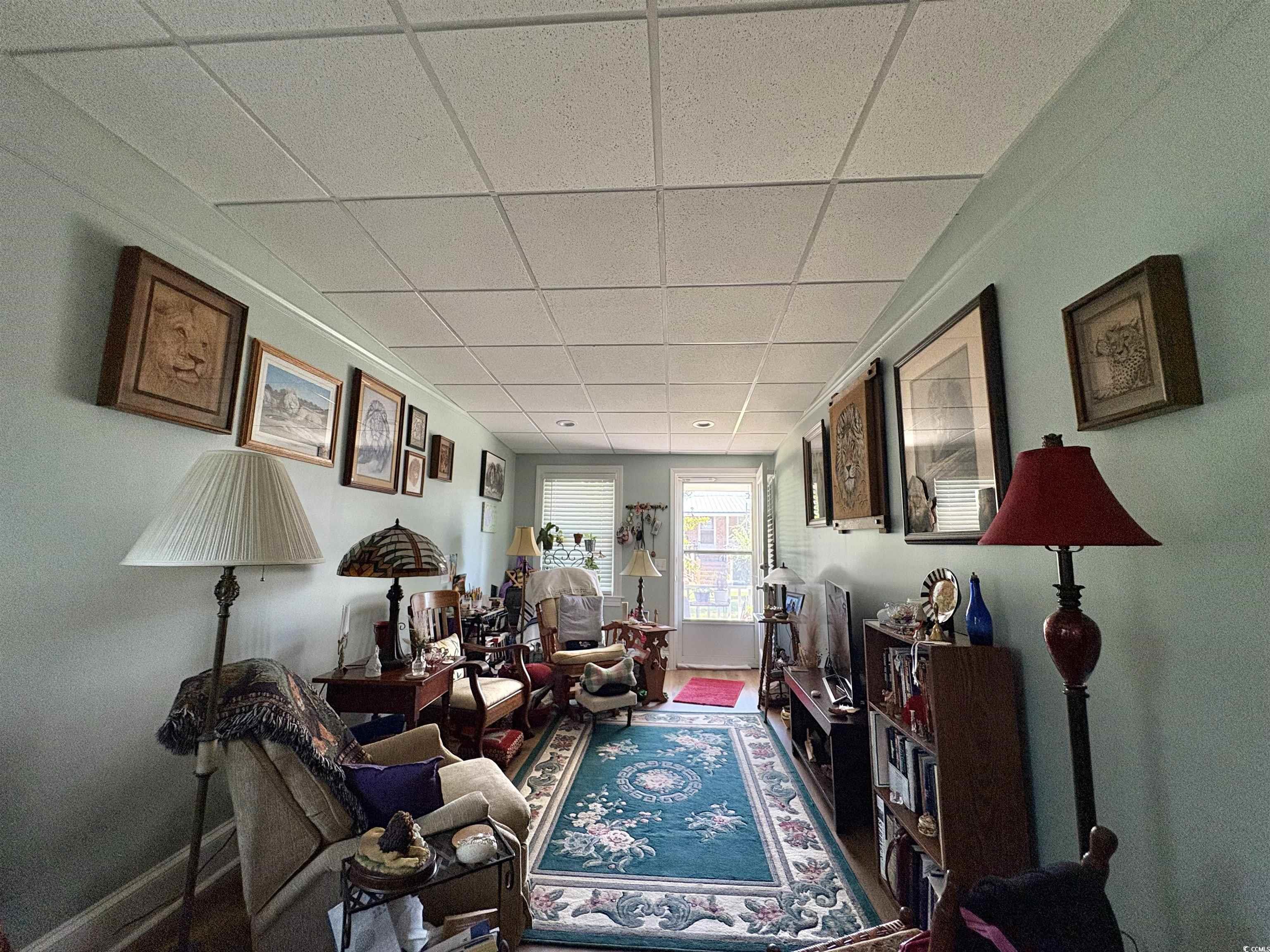 520-526 Boundary Avenue Murrells Inlet, SC 29576 - Photo 21 of 38 Living area featuring a paneled ceiling and baseboards