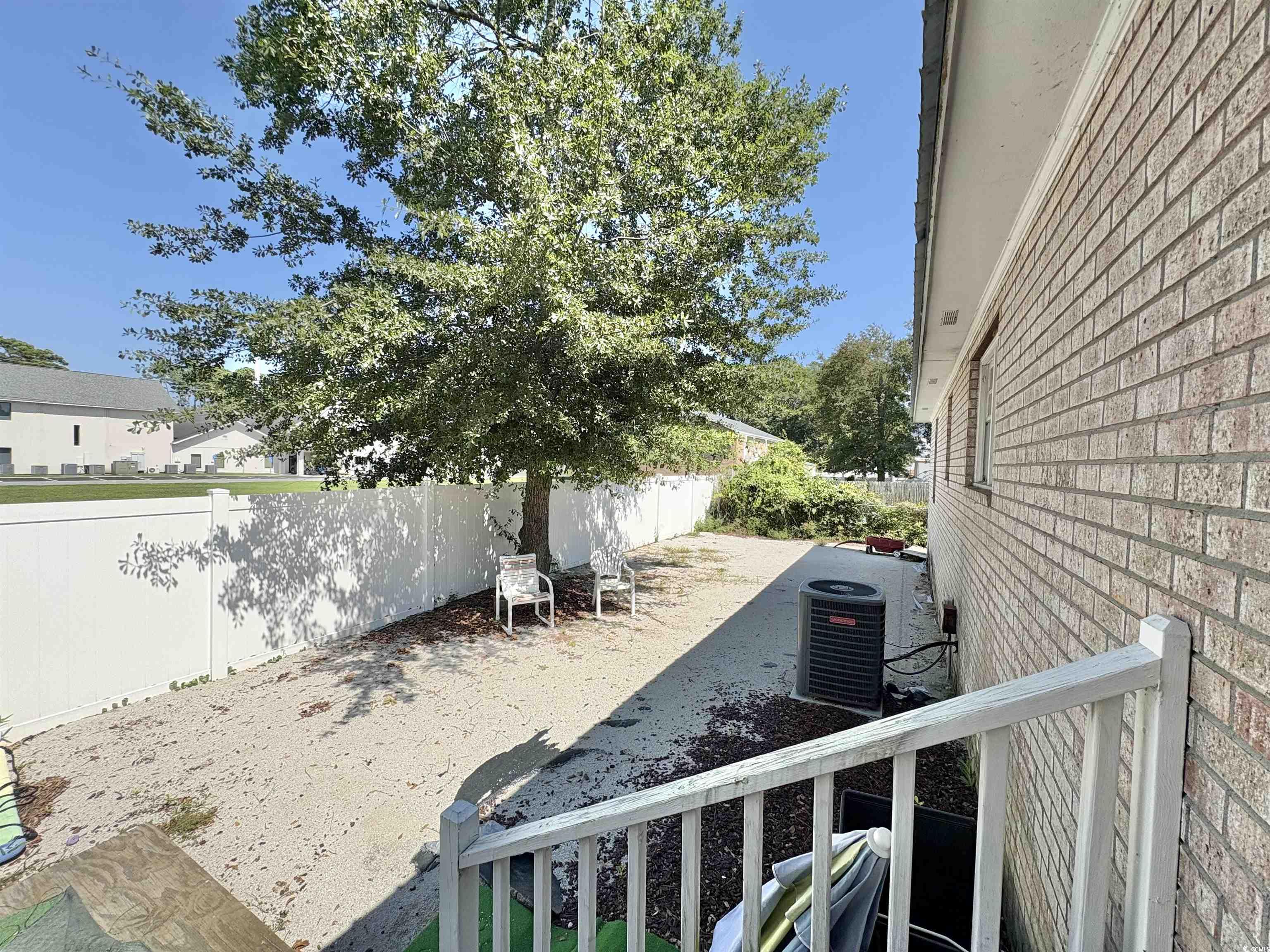 520-526 Boundary Avenue Murrells Inlet, SC 29576 - Photo 38 of 38 Fenced backyard featuring a patio
