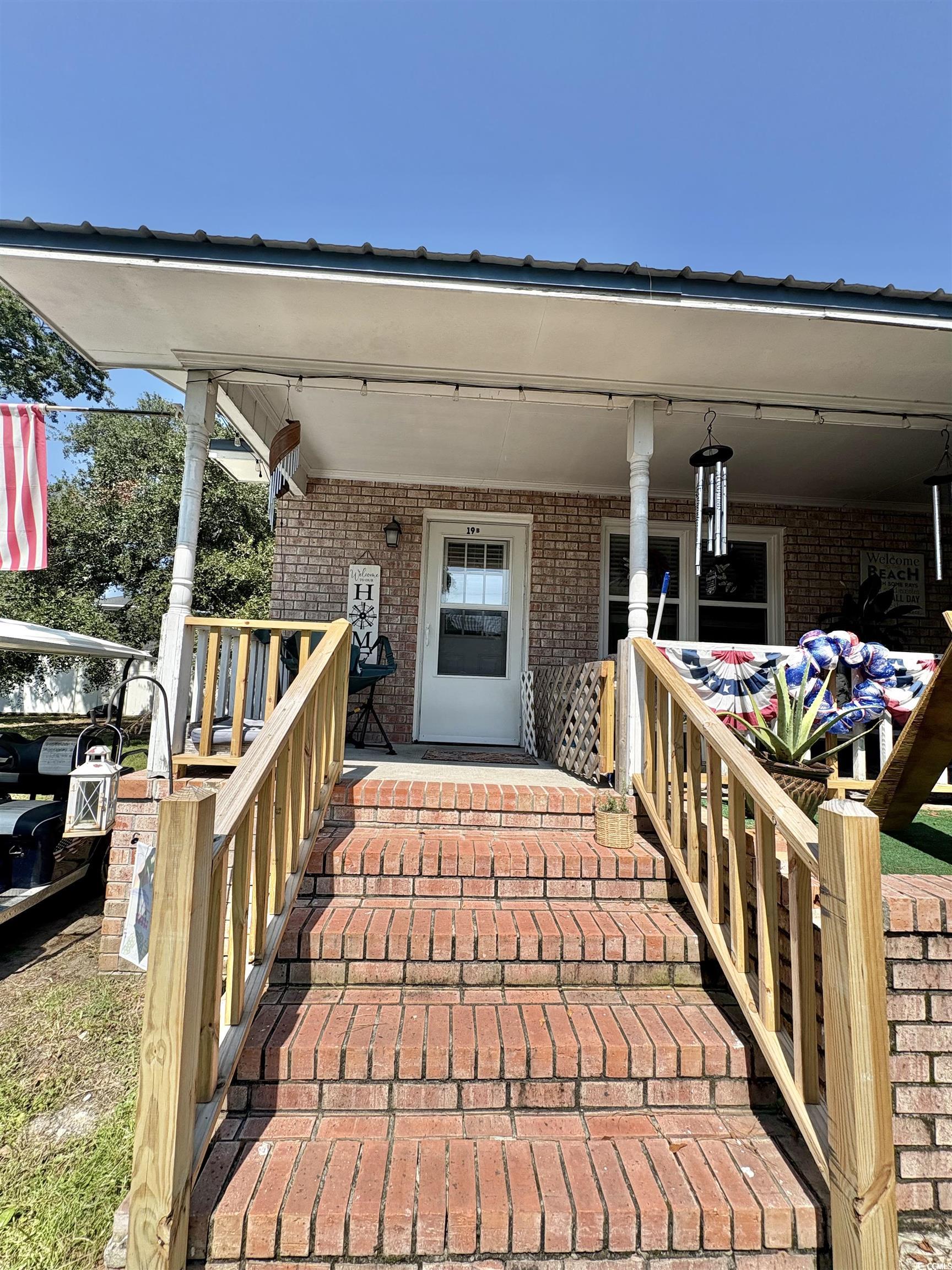 520-526 Boundary Avenue Murrells Inlet, SC 29576 - Photo 4 of 38 Doorway to property with brick siding