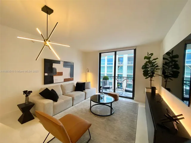 a bedroom with a bed and a television