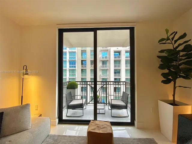 a view of a hallway view with wooden floor and a fireplace