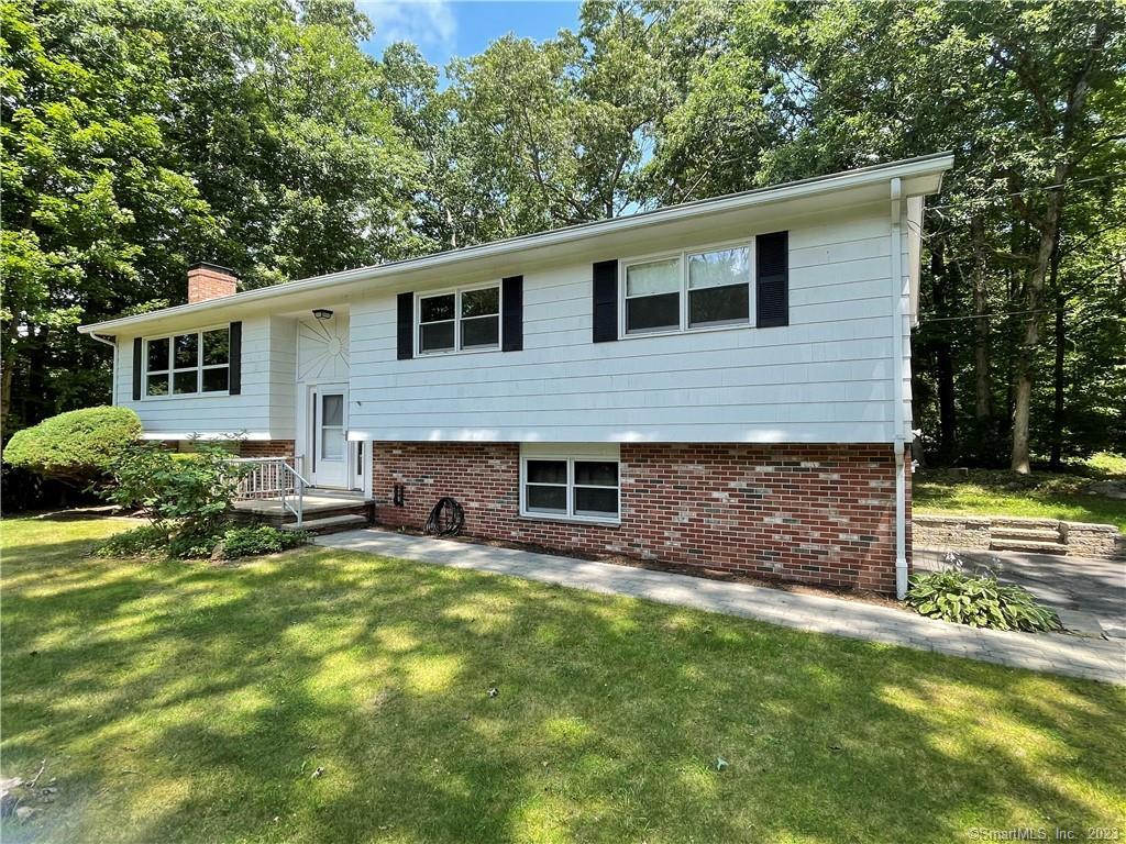 5 Silas Deane Road Ledyard, CT 06339 - Photo 1 of 1 a view of a house with backyard and sitting area