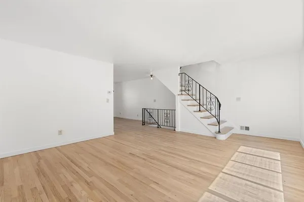 a view of wooden floor and staircase