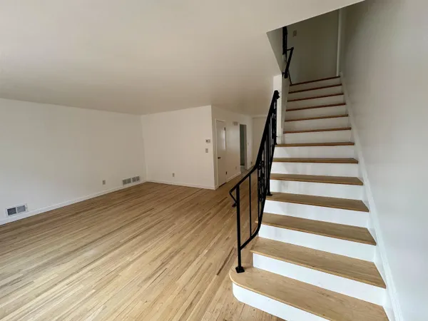 a view of entryway with wooden floor