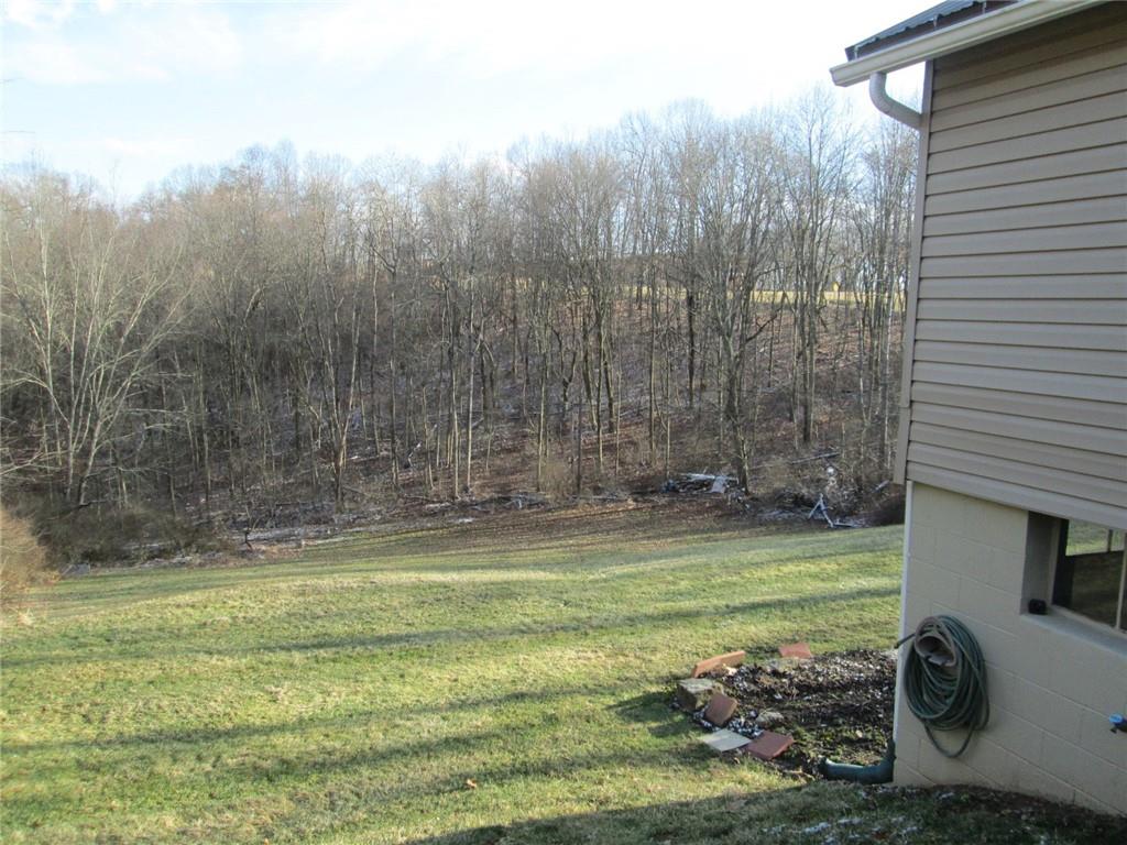1651 Freeport Road Kittanning, PA 16201 - Photo 4 of 11 a view of a swimming pool with a big yard and large trees