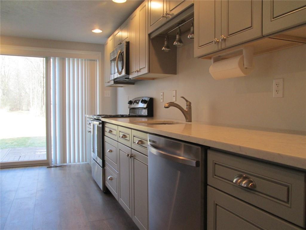 1651 Freeport Road Kittanning, PA 16201 - Photo 6 of 11 a kitchen with stainless steel appliances a sink dishwasher a stove and a refrigerator
