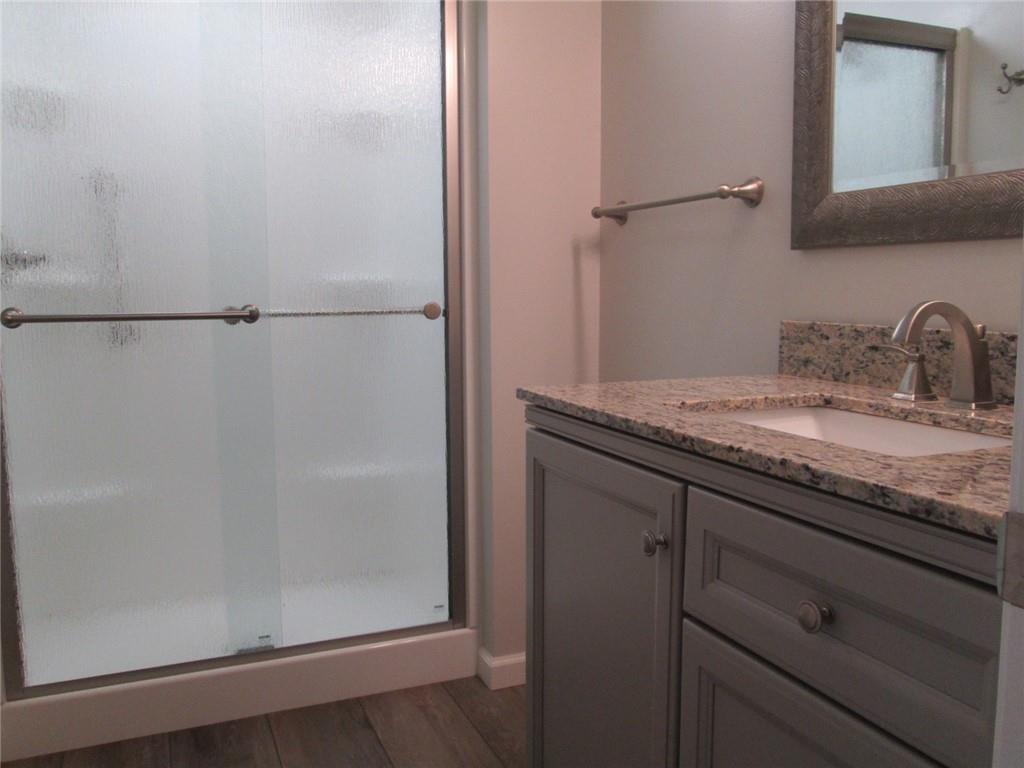 1651 Freeport Road Kittanning, PA 16201 - Photo 8 of 11 a bathroom with a granite countertop sink and mirror