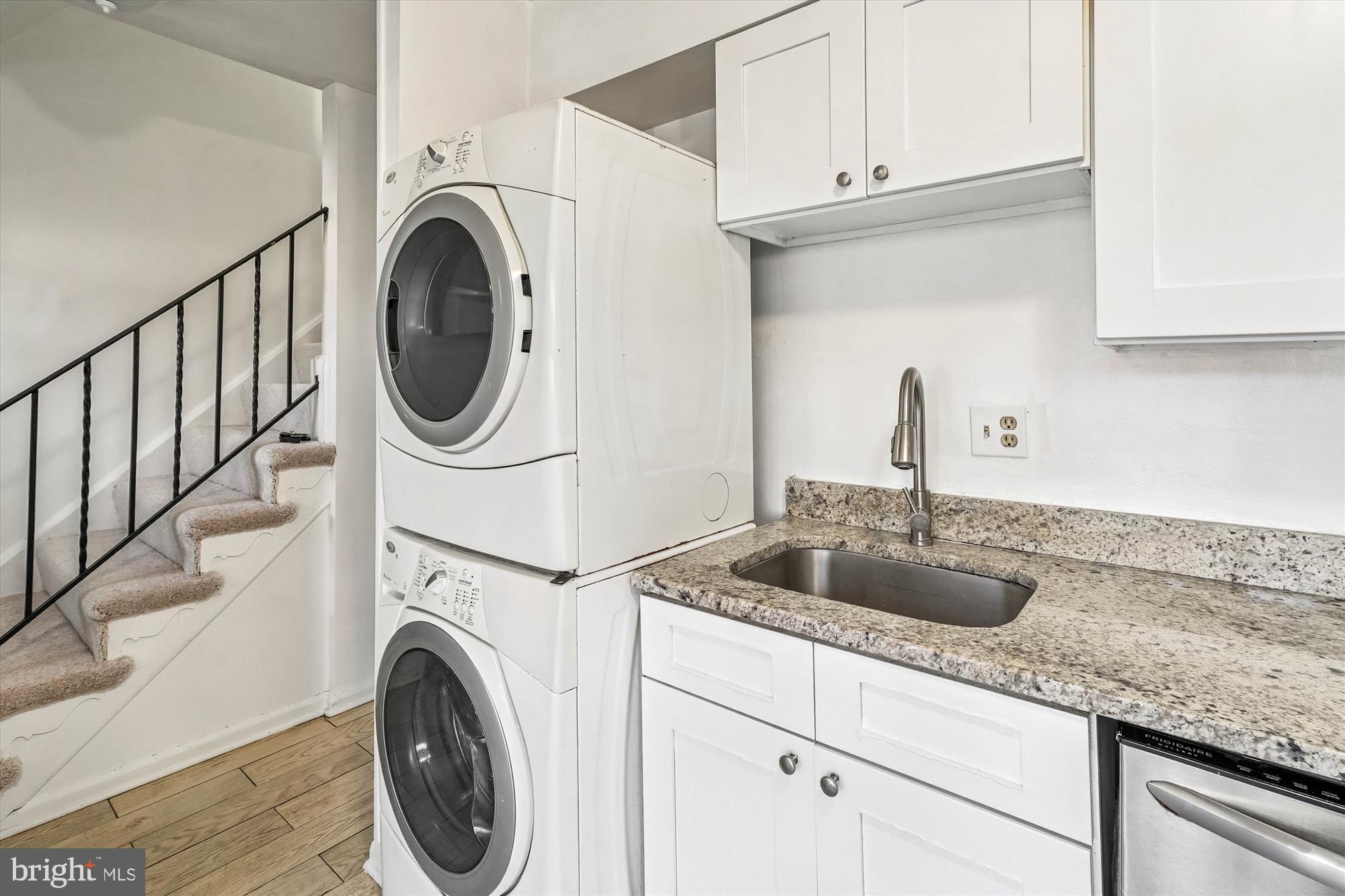 8347 Irongate Way Manassas, VA 20109 - Photo 15 of 42 a kitchen with sink a washer and dryer