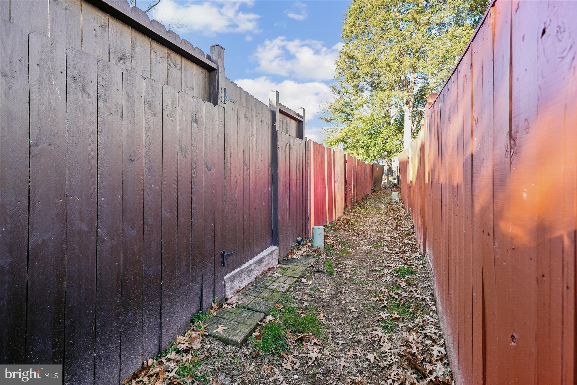 8347 Irongate Way Manassas, VA 20109 - Photo 30 of 42 a view of a pathway with a wooden fence