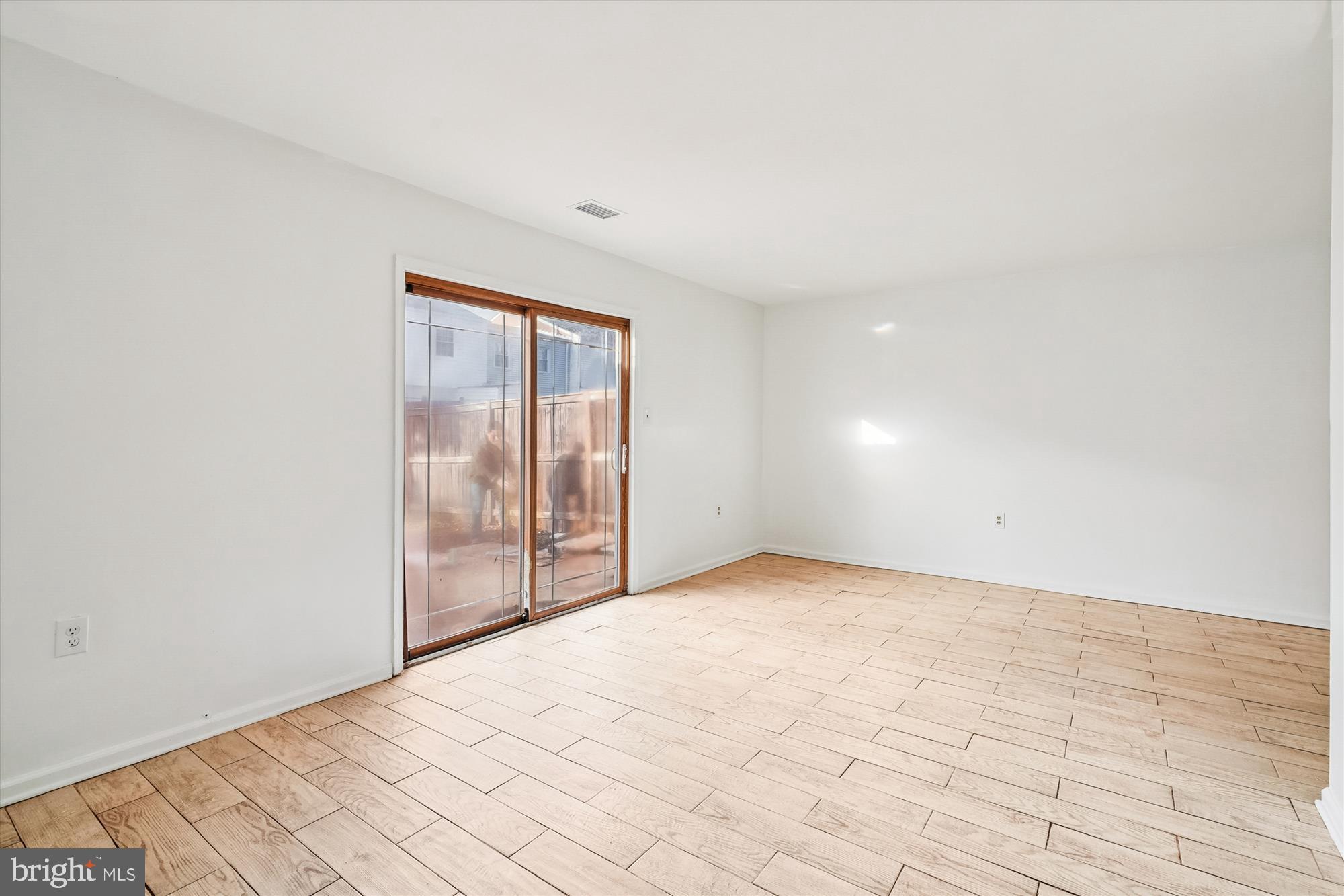 8347 Irongate Way Manassas, VA 20109 - Photo 4 of 42 an empty room with sliding door