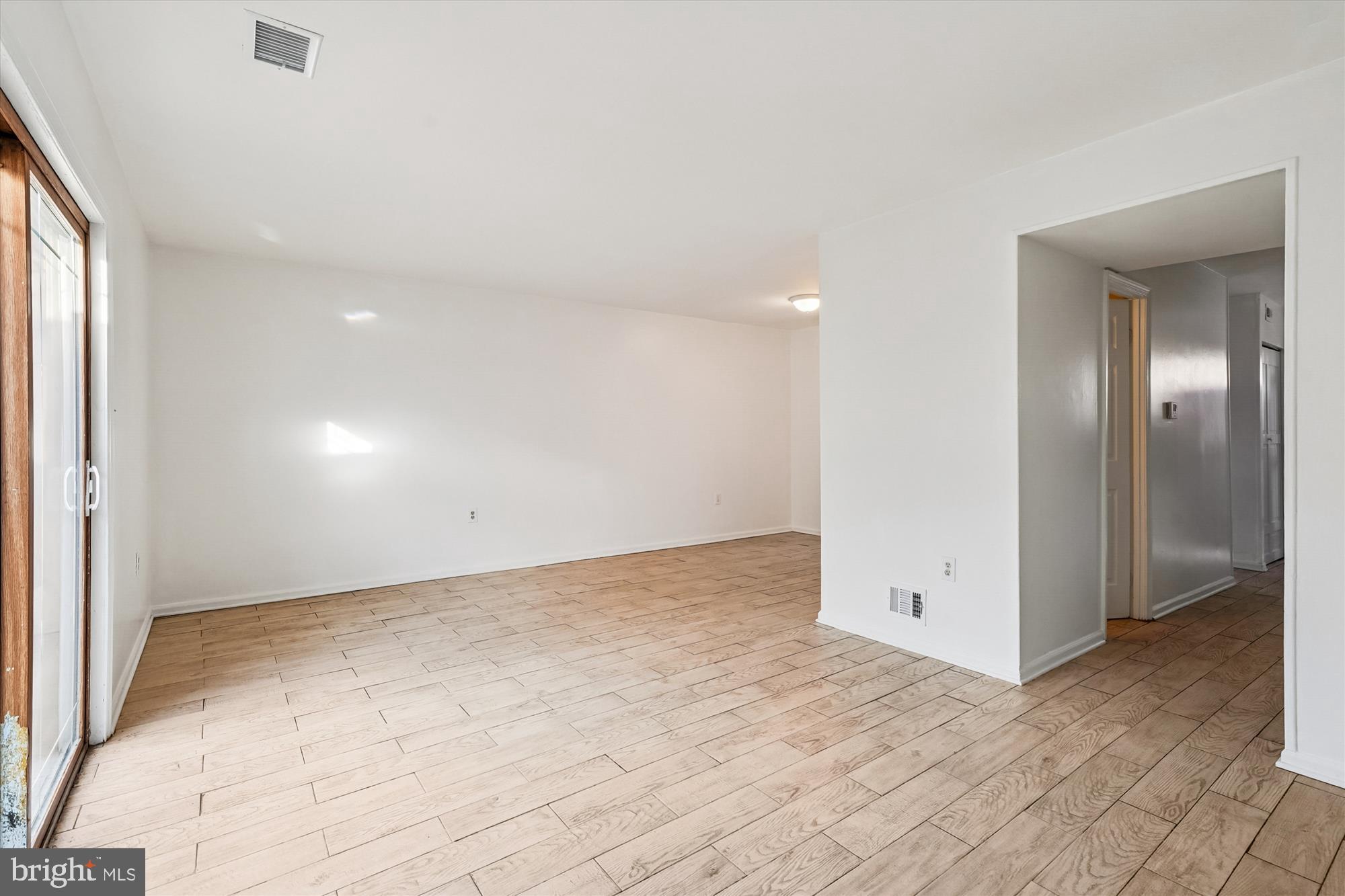 8347 Irongate Way Manassas, VA 20109 - Photo 7 of 42 an empty room with fan and entrance