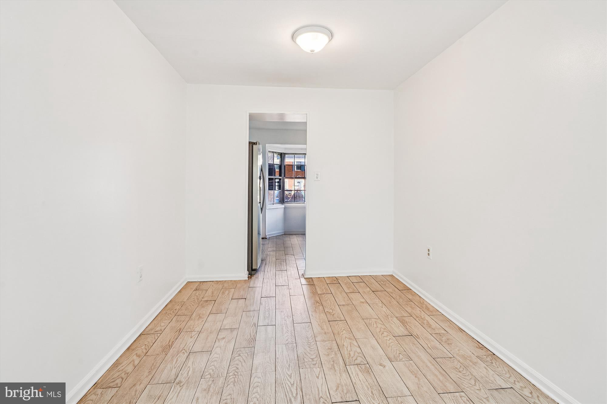 8347 Irongate Way Manassas, VA 20109 - Photo 8 of 42 a view of empty room with wooden floor