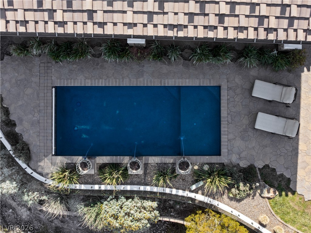 1123 Christian Road Henderson, NV 89002 - Photo 90 of 94 An aerial perspective showcases a private pool area bordered by verdant landscaping and ample patio space.
