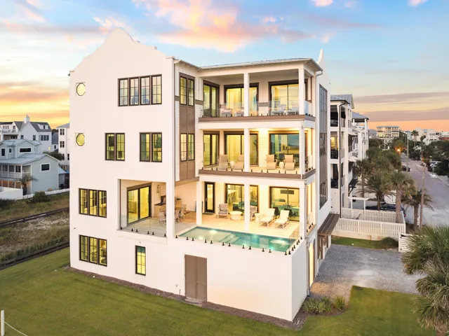 a front view of a residential apartment building with a yard