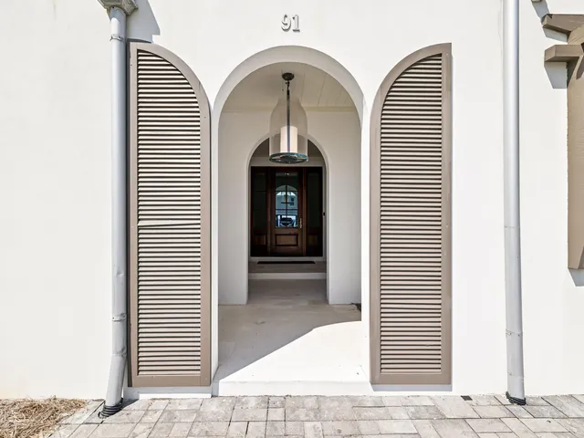 a view of an entryway with wooden floor
