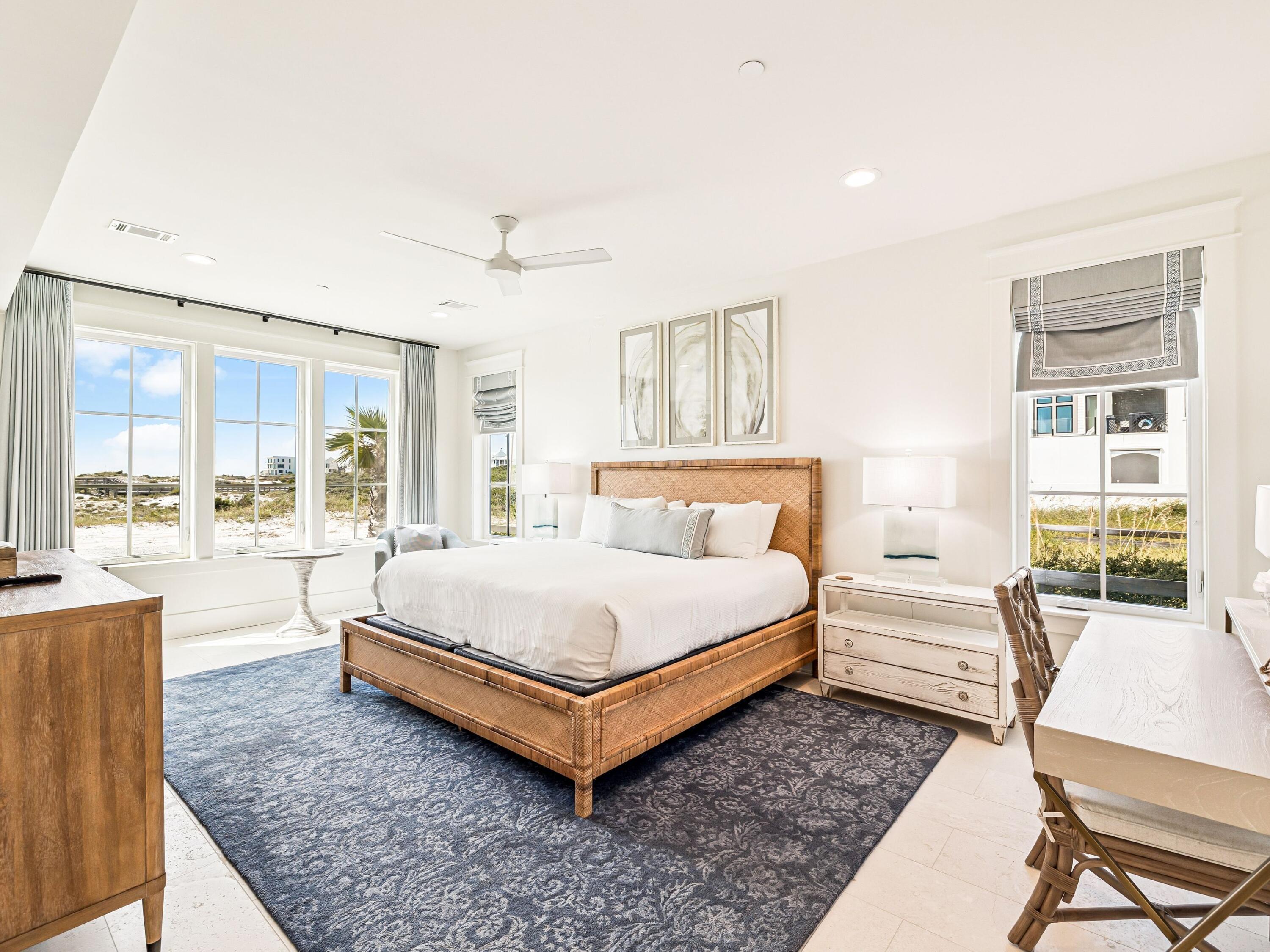91 Emerald Cove Lane North Inlet Beach, FL 32461 - Photo 17 of 53 a spacious bedroom with a bed and wooden floor