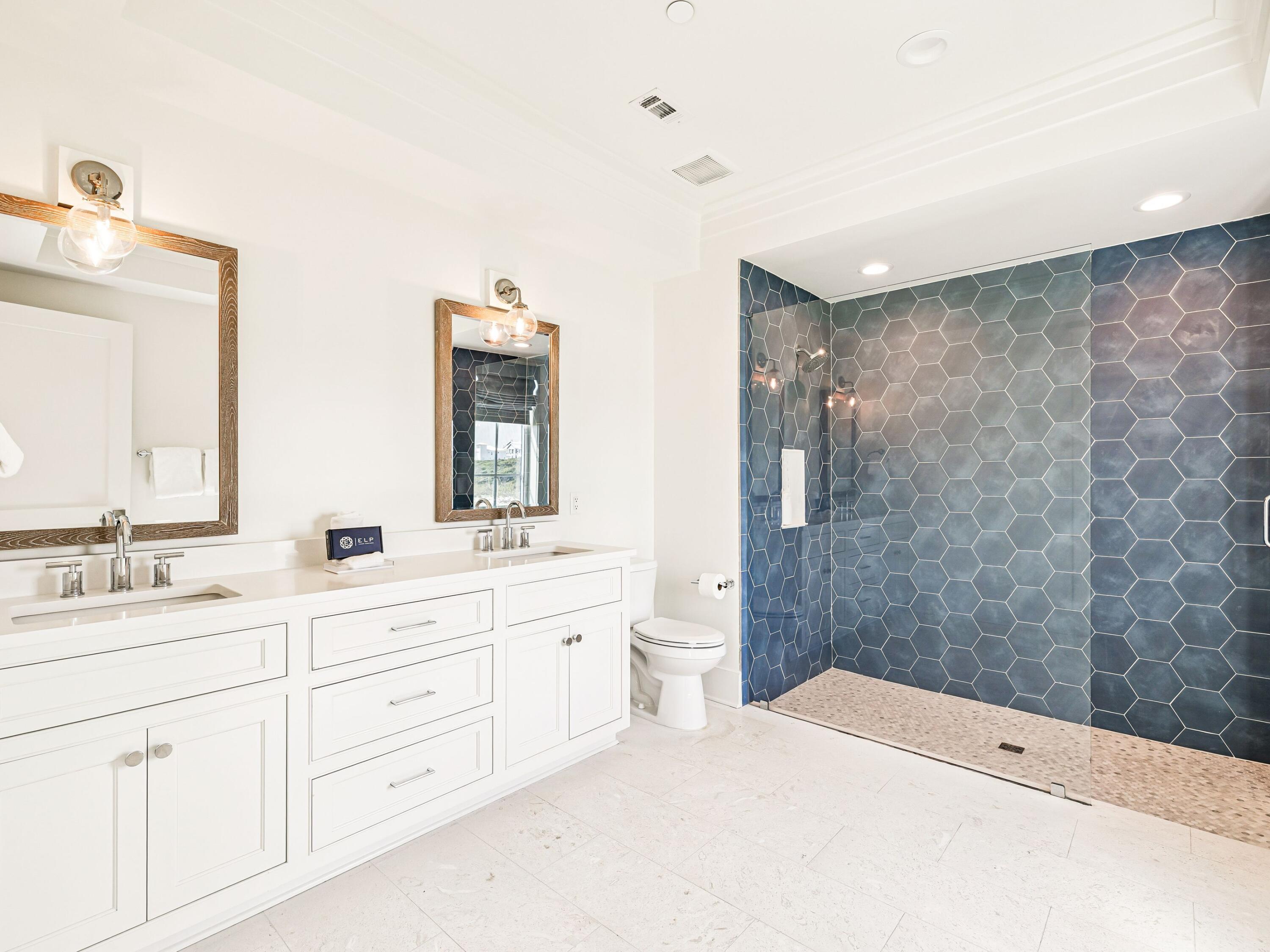 91 Emerald Cove Lane North Inlet Beach, FL 32461 - Photo 18 of 53 a room with a double vanity sink mirror and