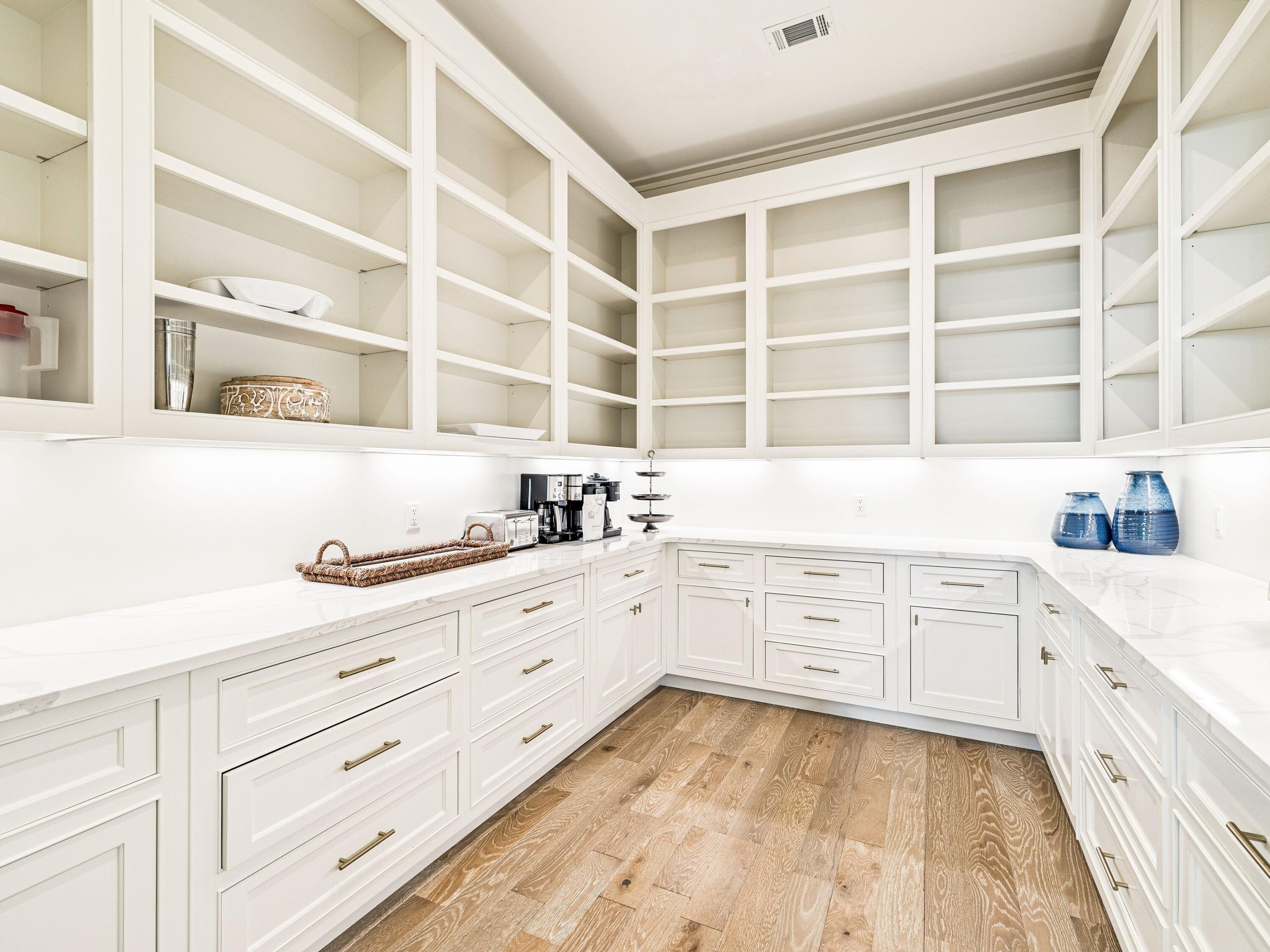 91 Emerald Cove Lane North Inlet Beach, FL 32461 - Photo 23 of 53 a kitchen with granite countertop white cabinets and white stainless steel appliances