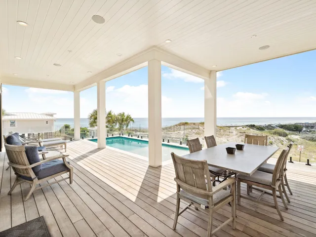 a view of an outdoor space with furniture and garden