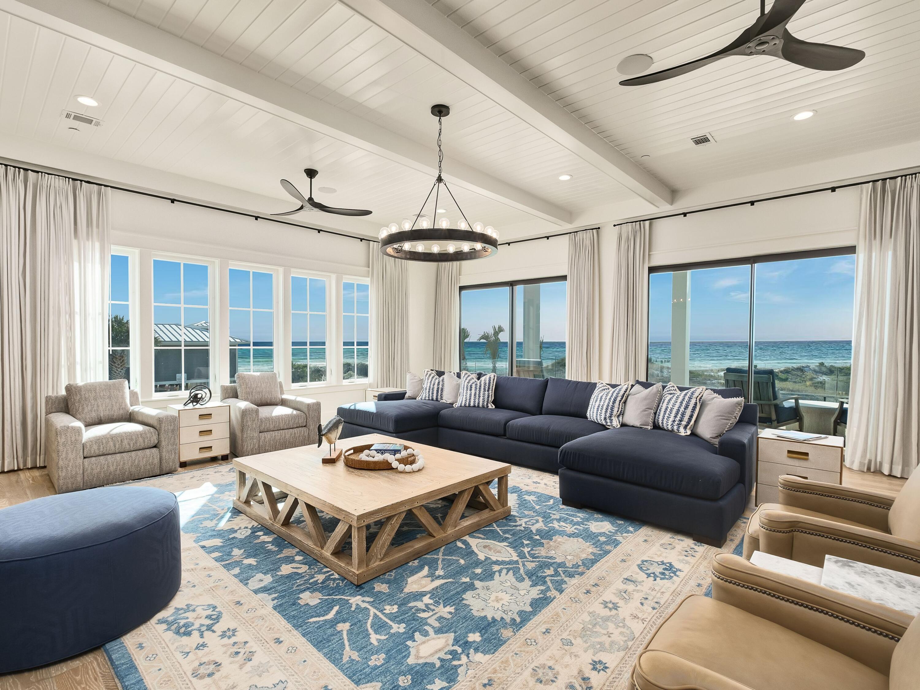 91 Emerald Cove Lane North Inlet Beach, FL 32461 - Photo 3 of 53 a living room with furniture ceiling fan and a large window