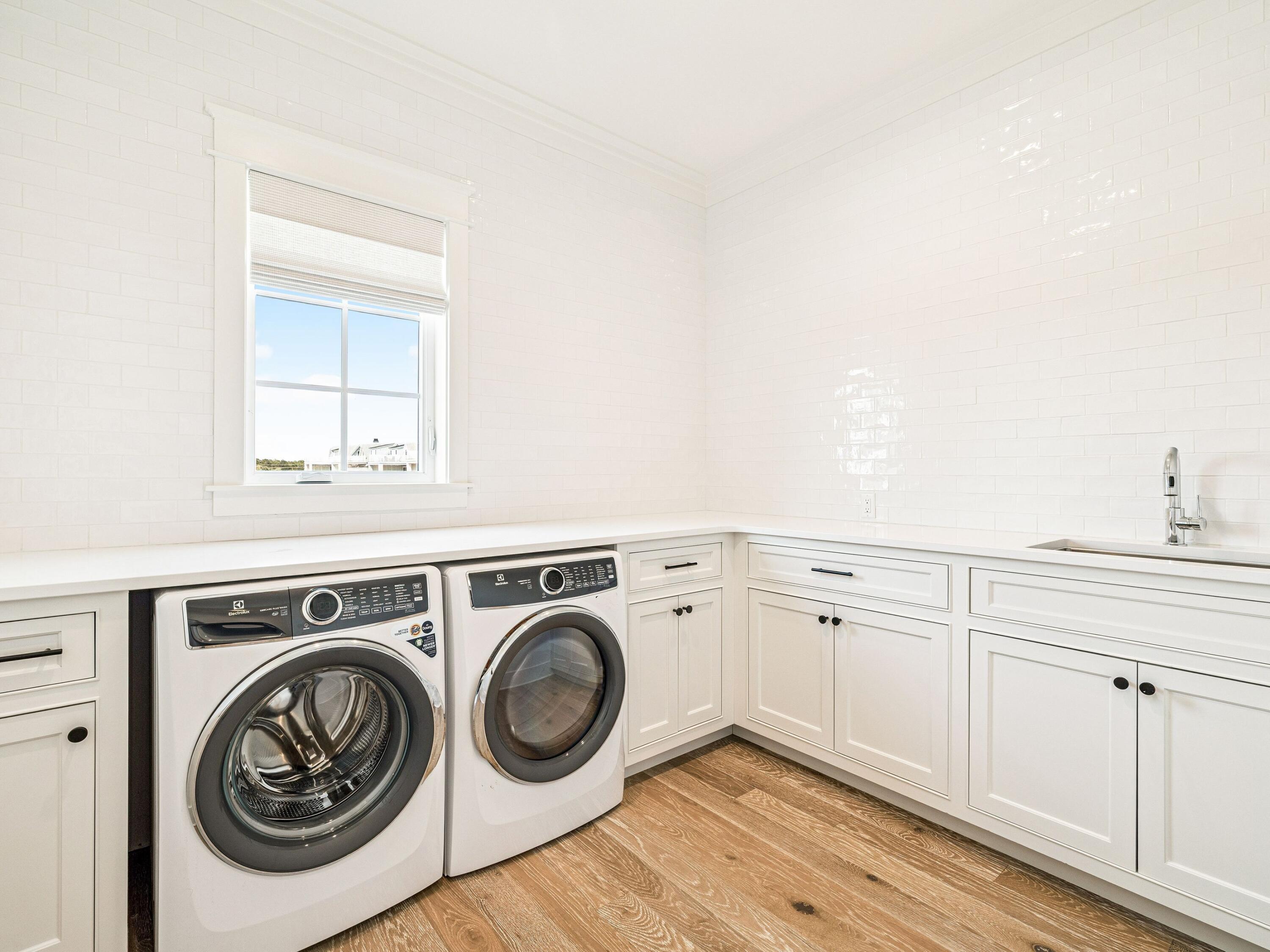 91 Emerald Cove Lane North Inlet Beach, FL 32461 - Photo 31 of 53 a utility room with sink dryer and washer
