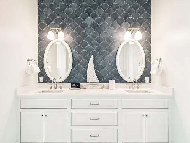 a bathroom with a sink and mirror