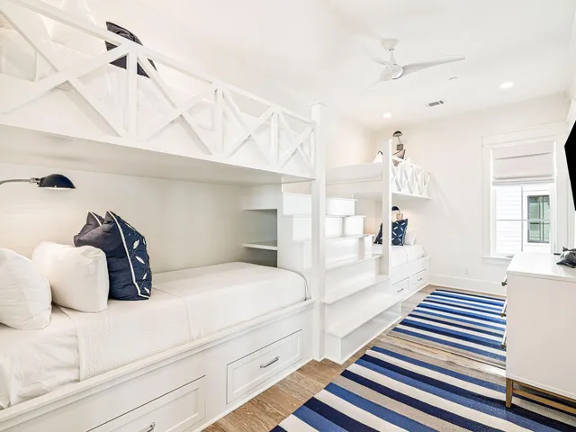 a spacious bedroom with a bed and a large window