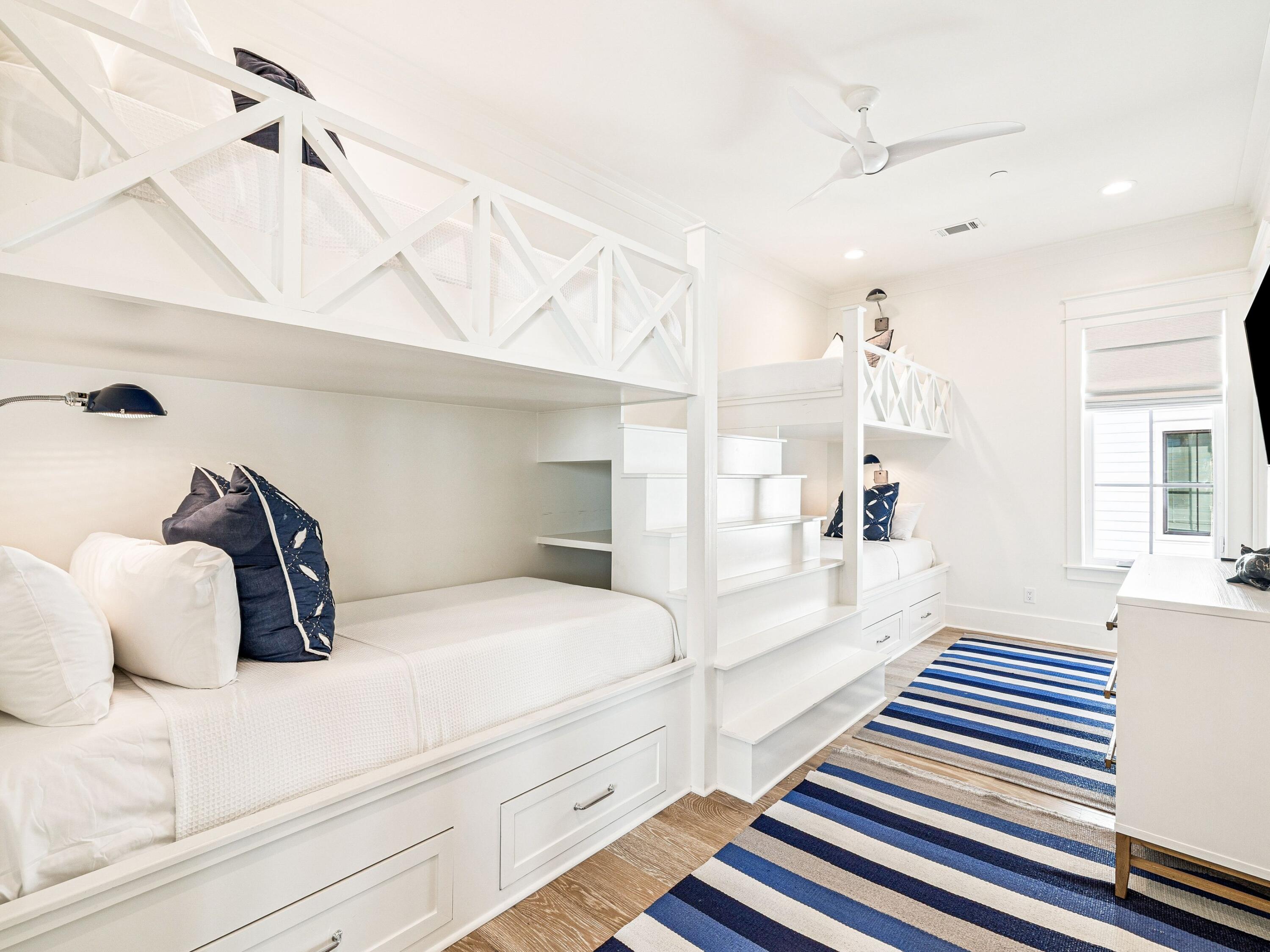 91 Emerald Cove Lane North Inlet Beach, FL 32461 - Photo 35 of 53 a bedroom with a large bed and a chandelier