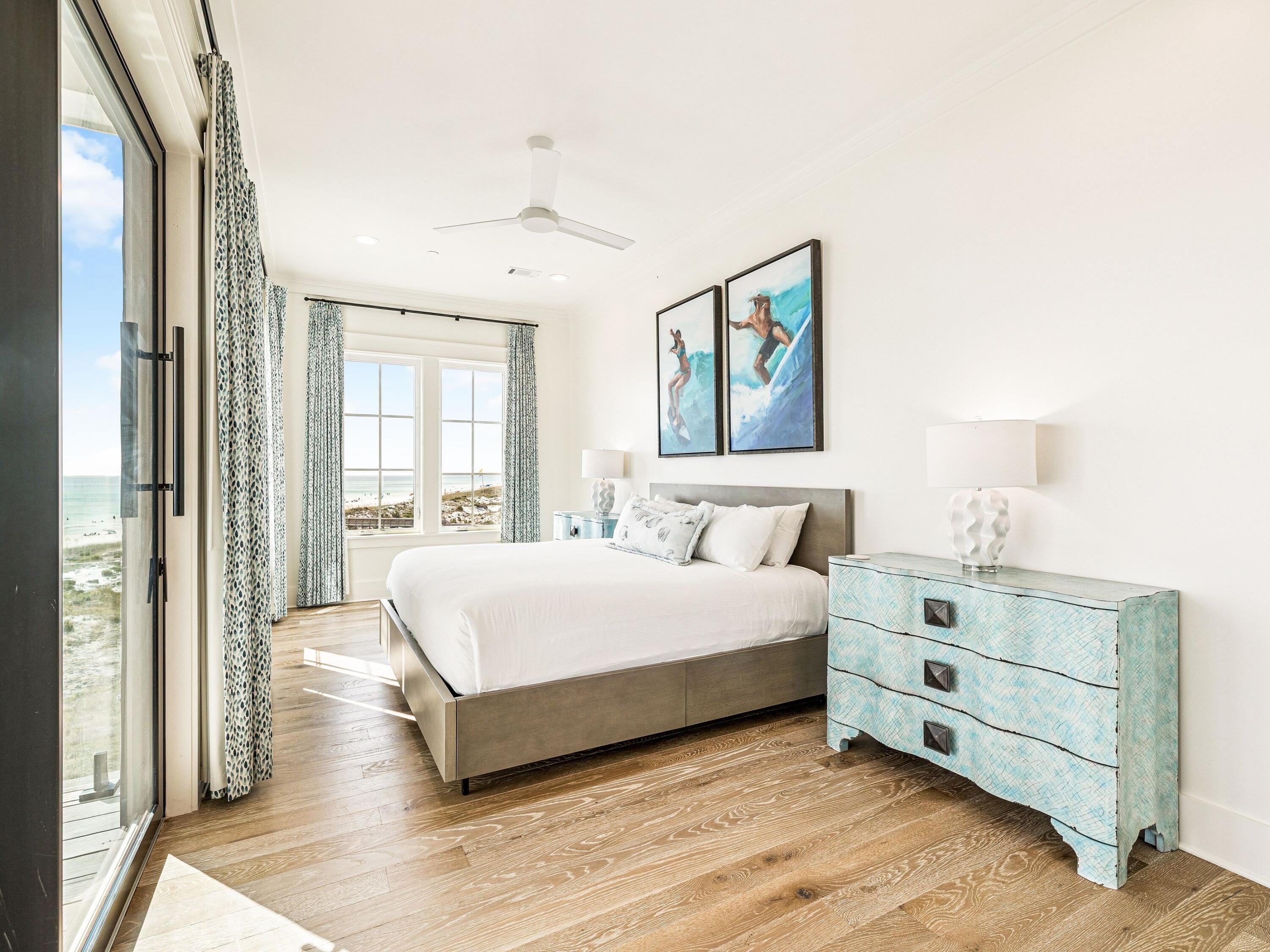 91 Emerald Cove Lane North Inlet Beach, FL 32461 - Photo 37 of 53 a spacious bedroom with a bed and a large window