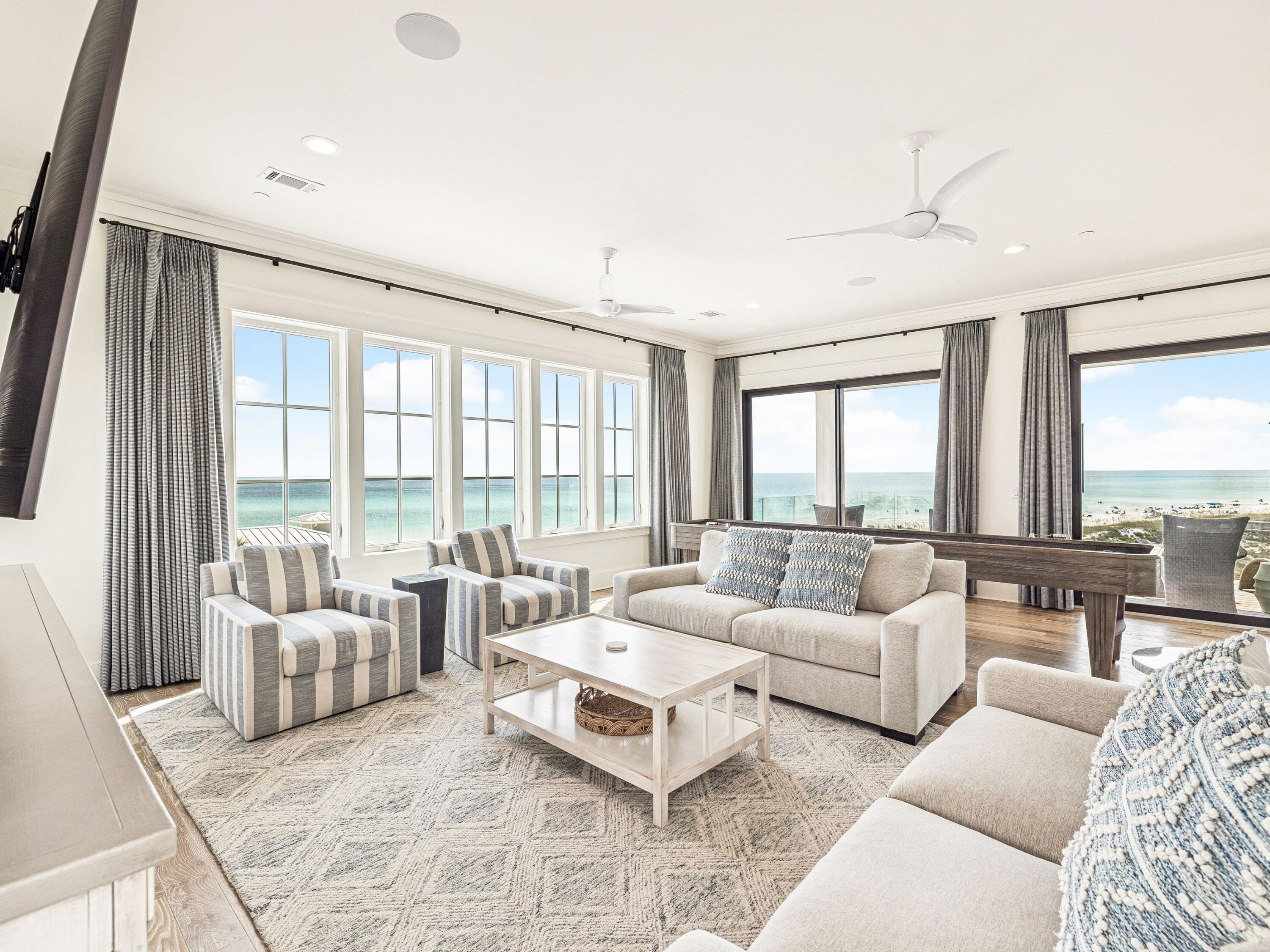 91 Emerald Cove Lane North Inlet Beach, FL 32461 - Photo 39 of 53 a living room with furniture and floor to ceiling windows