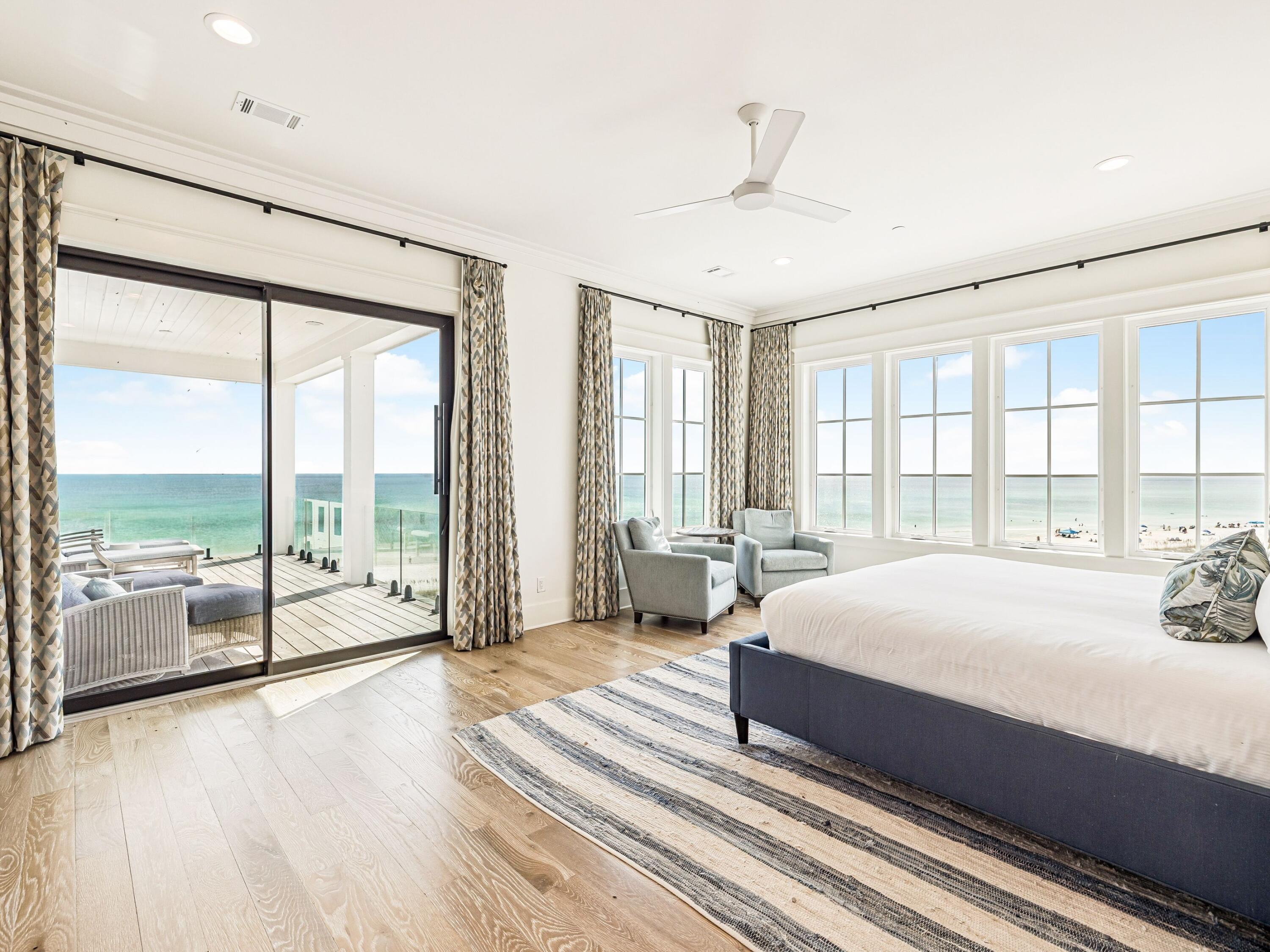 91 Emerald Cove Lane North Inlet Beach, FL 32461 - Photo 41 of 53 a spacious bedroom with a large bed and a large window