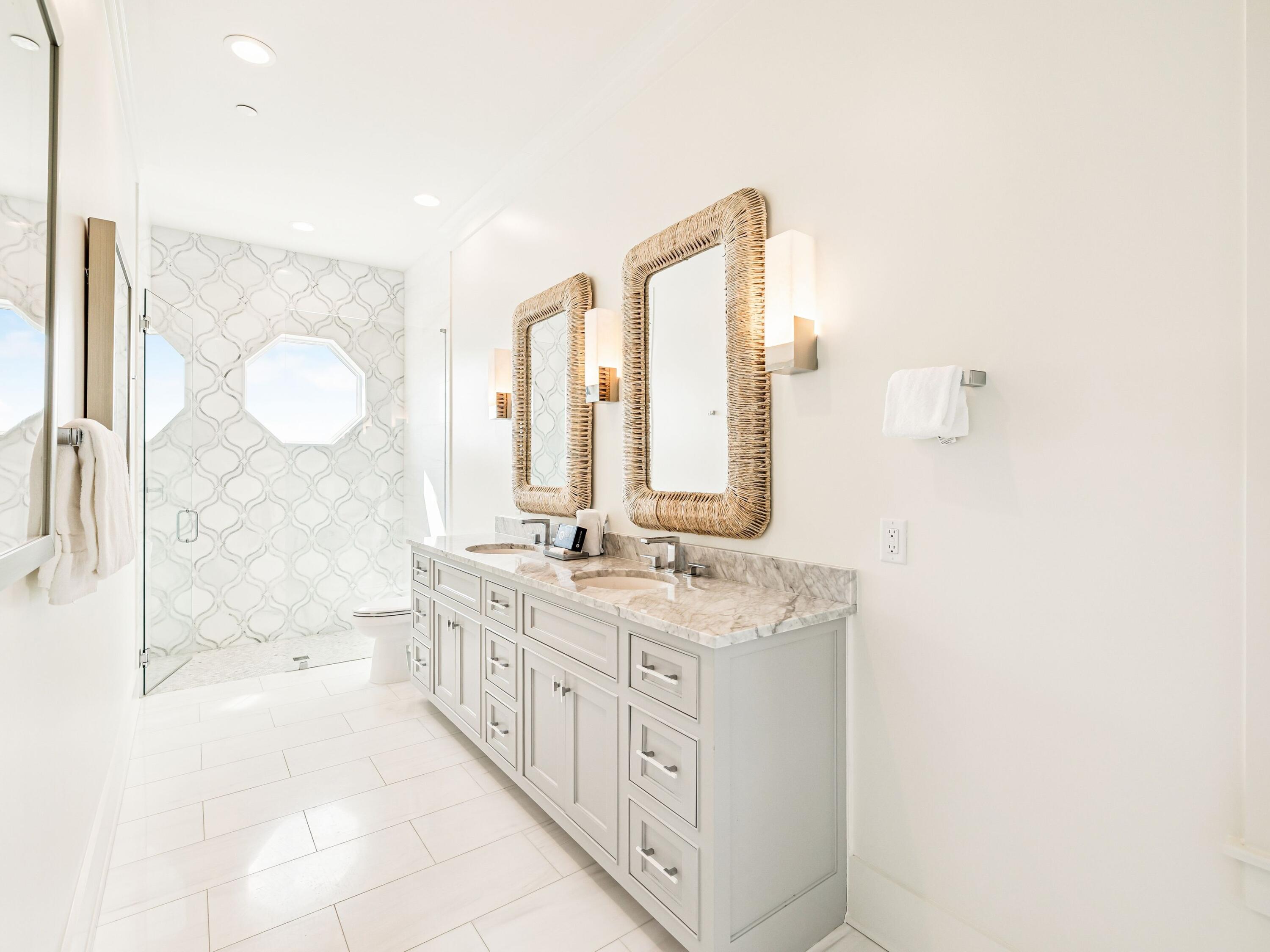 91 Emerald Cove Lane North Inlet Beach, FL 32461 - Photo 43 of 53 a bathroom with a double vanity sink toilet mirror and bathtub