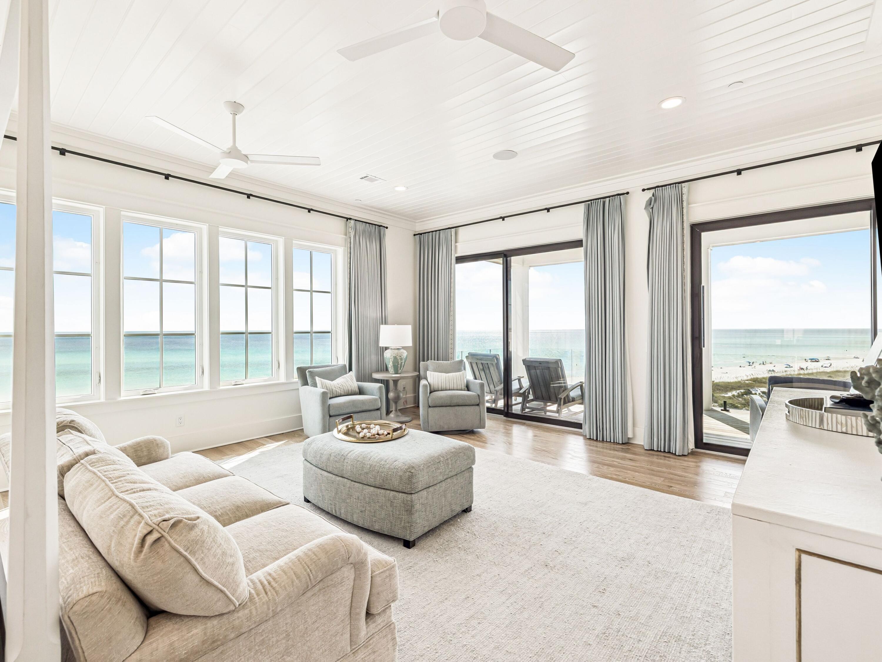 91 Emerald Cove Lane North Inlet Beach, FL 32461 - Photo 45 of 53 a living room with furniture and floor to ceiling windows