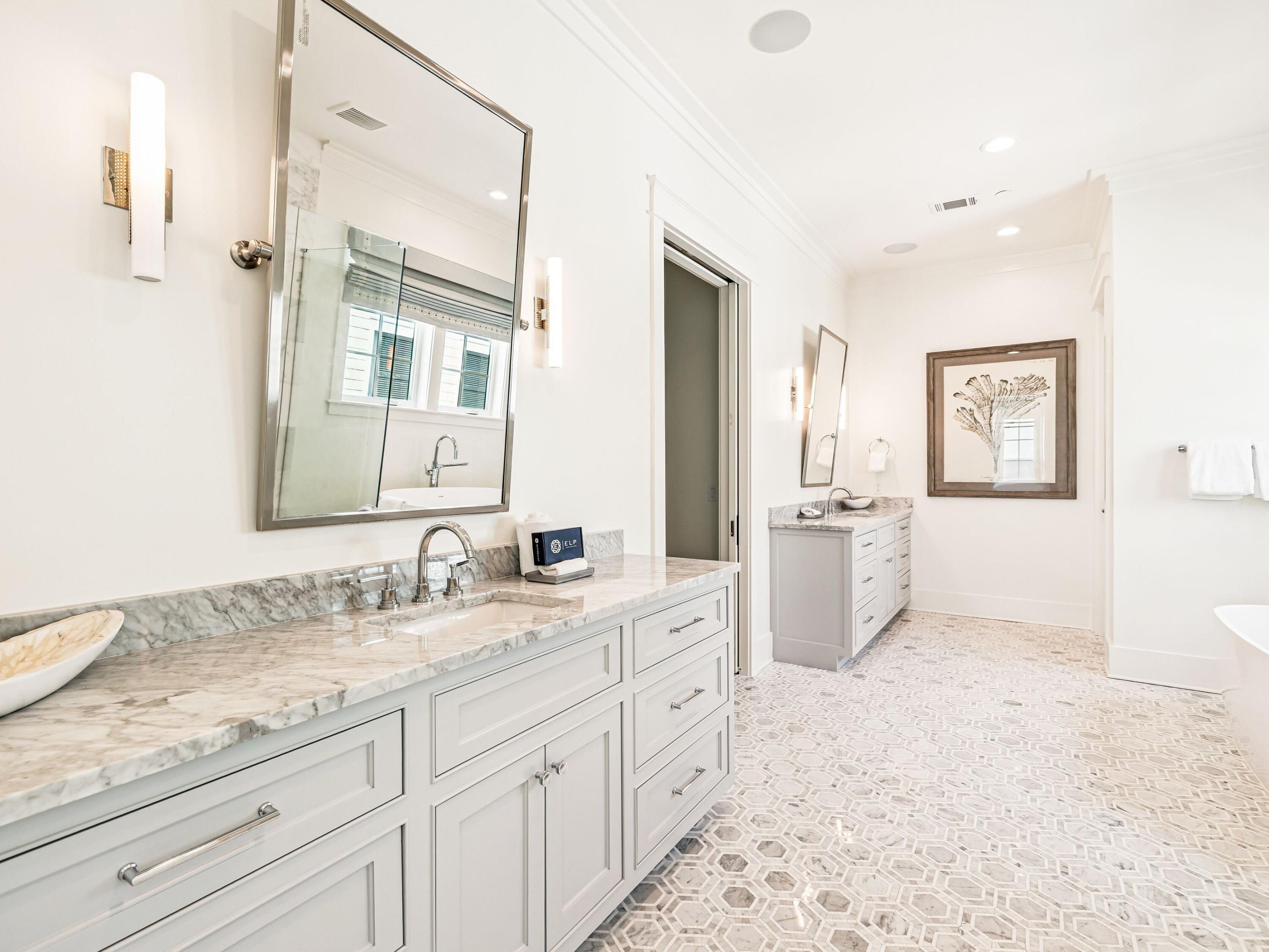 91 Emerald Cove Lane North Inlet Beach, FL 32461 - Photo 48 of 53 a spacious bathroom with a granite countertop sink mirror and